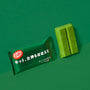 A green-wrapped KitKat bar with Japanese text is displayed beside two unwrapped green KitKat pieces on a vibrant green background, offering a tempting preview of the authentic treats featured in the Dagashi Snack Crate—your 30-piece Japanese Snack Variety Box packed with candy, chocolate, cookies, mochi, and Ramune delights. thumbnail 28