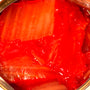 A can of Wang Tinned Napa Cabbage Kimchi with a spoon in it. thumbnail 2