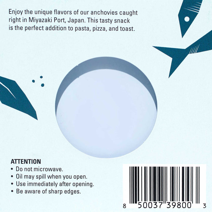 Packaging for Bokksu Tinned Shirasu Anchovies with Black Pepper and Basil-Infused Oil (2-Pack) from Miyazaki Port, Japan, highlighting their use in various dishes like umami spaghetti. Includes warnings: &quot;Do not microwave, oil may spill, use immediately after opening, and beware of sharp edges. thumbnail 5