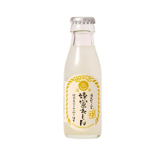 A clear glass bottle with a silver cap and a "Hachimitsu Lemon" label, featuring yellow and black Japanese text on white and gold, is part of the Doki Doki Snack Adventure Crate (10 pcs) assortment.