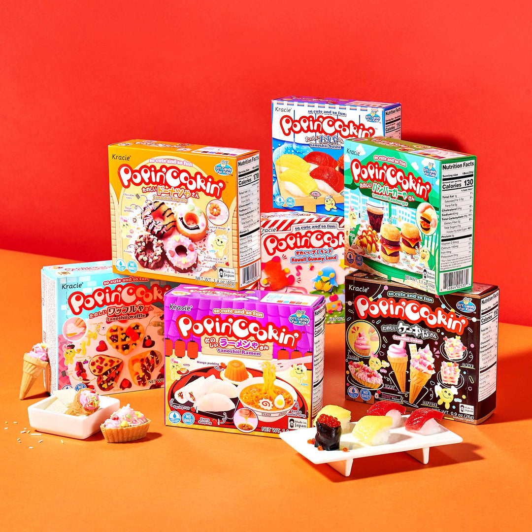 The DIY Candy Kit Pack (6-Pack) by Bokksu Market is showcased against a vibrant red background, with delightful examples of homemade candy displayed in front.