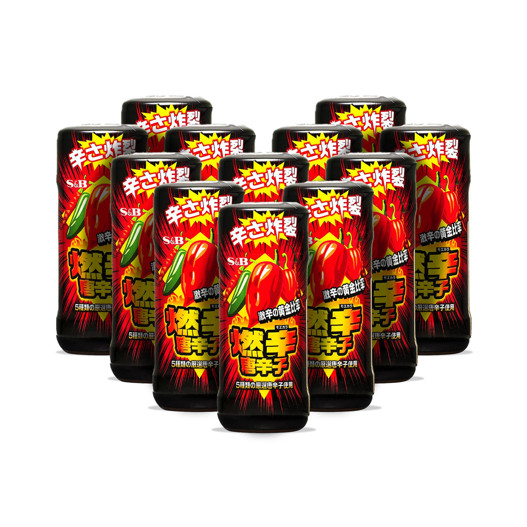 Nine cans of S&B Moekara Extra Hot Red Pepper, featuring vibrant graphics with extra hot red peppers on black backgrounds, are neatly arranged in a group.