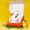 An open Japanese Fruits Gummy Box displays a colorful assortment of fruit gummies, with additional gummies and whole lemons scattered around on a vibrant yellow background.