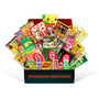 Experience the flavors of Japan with the Dagashi Snack Crate – a 30-piece Japanese Snack Variety Box featuring an assortment of candy, chocolate, cookies, mochi, and Ramune treats. Each open package displays a tempting array of snacks arranged upright beside the "Experience Japan Through Snacks" label, offering you an exciting way to discover authentic Japanese treats. thumbnail 1