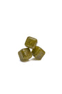 Three Bokksu Sweet Matcha Drops, greenish-brown hard candies, are stacked against a white background. thumbnail 4