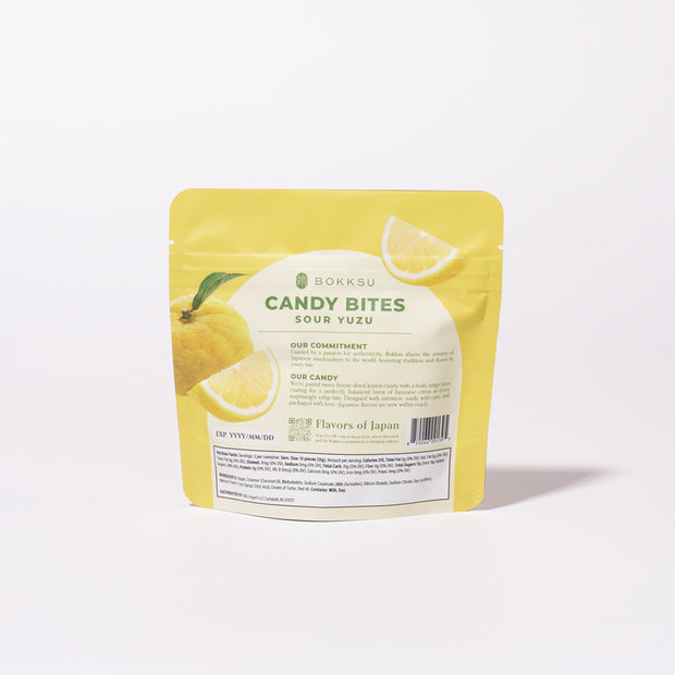 A yellow resealable pouch labeled "Sour Yuzu Japanese Candy Bites 0.75oz" displays yuzu fruit and lemon slices, highlighting this vibrant Japanese candy against a plain white background.