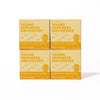 Four boxes of Bokksu Tinned Shirasu Anchovies with Yuzu Pepper (4-Pack) are arranged in a two-by-two grid on a white background—a perfect protein snack infused with the zesty spice of yuzu kosho.