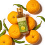 Overview of a Bokksu Japanese Yuzu Hot Sauce on top of Yuzu and Togarashi Pepper thumbnail 2