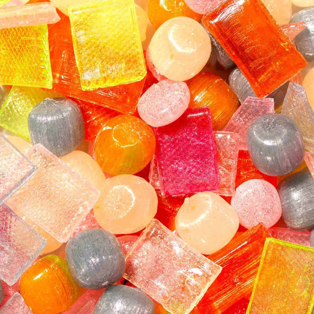 Enjoy an assortment of vibrant, handmade Kyoto candies in various shapes and colors with the Daimonji Ame Honpo Handmade Candy Gift Box (12 Bags, 6 Flavors), featuring classic Japanese sweets in shades of red, orange, pink, yellow, and gray.