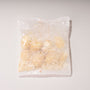 A clear plastic wrapper containing light brown, powdery Doki Doki Snack Mix: Japan Mochi Puffs is photographed on a plain white background. thumbnail 3