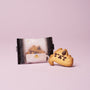 A cat-shaped cookie rests next to its clear packaging on a light pink background—a delightful treat, ideal for inclusion in The Cat Lover’s Box or as a charming Japanese-inspired cat gift. thumbnail 7
