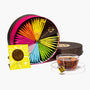 A Kagoshima Seicha Gift Box: Satsumarche Tea Bags (49 pieces, 7 flavors) is shown with a clear glass teacup and a yellow tea packet, all displayed on a white background. thumbnail 1