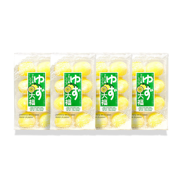 Four clear plastic packages of Kubota Daifuku Mochi: Yuzu (4 Pack), featuring yellow, round mochi labeled "Yuzu Daifuku," a refreshing Japanese dessert, displayed on a white background.