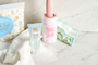 Hand soap, a lint roller, towel, and cartoon cleaning cloth from the Kawaii Gift Pack - Stationery Surprises &amp; Japanese Chocolate Treats are arranged on a white surface—ideal for fans of cute essentials and kawaii stationery. thumbnail 3