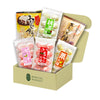 An open Bokksu Market Mochi Bundle box containing assorted packaged Japanese snacks, featuring mochi and daifuku in flavors like matcha, strawberry, and peach.
