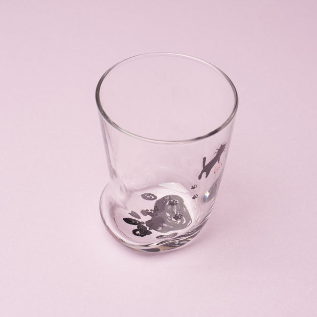 Certainly! Here’s a rewritten version using your product data: Clear glass featuring black cat illustrations, displayed on a light pink surface—an ideal addition to The Cat Lover’s Box or as a delightful Japanese-inspired cat-themed gift.