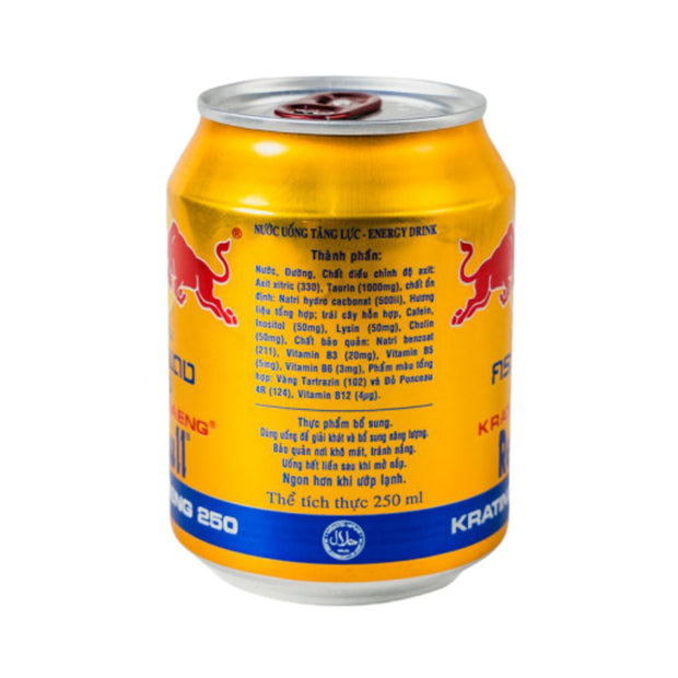 A can of Redbull Gold Energy Drink: Original features Vietnamese text listing ingredients and nutrition info on a yellow and blue background—ideal for anyone seeking a concentration-boosting energy drink.