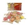 Individually wrapped Pine Candy: 3 Apple Flavors, including Fuji apple, are displayed in front of a partially visible package with Japanese text and fruit images. thumbnail 2