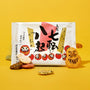 The Japanese Savory Snack Box features Japanese rice crackers with daruma illustrations and text, surrounded by assorted crackers on a yellow background—perfect for any snack collection or savory gift box. thumbnail 6