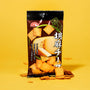 The Japanese Savory Snack Box, featuring popular Japanese sesame cheese crackers, with some crackers scattered around on a yellow background. thumbnail 4
