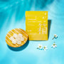A Bokksu Snack Box: Seasons of Japan pouch labeled "Handmade Yuzu Sake Candy" sits by round candies and white blossoms on a blue surface—offering an authentic taste of Japan in each delightful snack. thumbnail 23