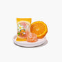 A plate featuring a wrapped orange Japanese candy from the Dagashi Snack Crate - 30-Piece Japanese Snack Variety Box with Candy, Chocolate, Cookies, Mochi &amp; Ramune Treats, an unwrapped orange candy, and a fresh orange slice on a white background. thumbnail 13