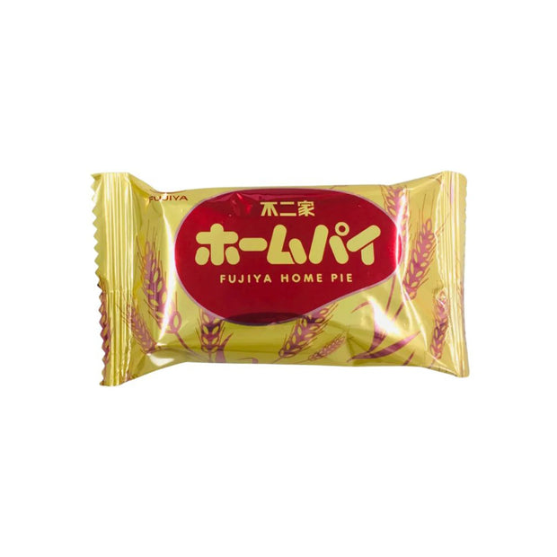 A Fujiya Home Pie snack wrapped in gold with red and yellow Japanese and English labeling, featuring wheat illustrations on the package—an iconic Japanese sweet that's an ideal addition to the Dagashi Snack Crate, a 30-piece variety box including candy, chocolate, cookies, mochi, and Ramune treats.