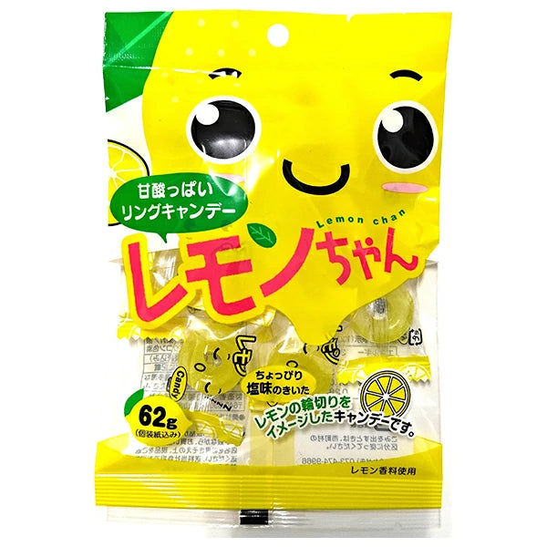 A package of Lemon Chan ring candies with a smiling lemon cartoon, Japanese text, and visible yellow candy pieces inside a clear window—a delightful treat included in the Dagashi Snack Crate 30-Piece Japanese Snack Variety Box for fans of authentic Japanese candy.