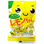 A package of Lemon Chan ring candies with a smiling lemon cartoon, Japanese text, and visible yellow candy pieces inside a clear window—a delightful treat included in the Dagashi Snack Crate 30-Piece Japanese Snack Variety Box for fans of authentic Japanese candy. thumbnail 17